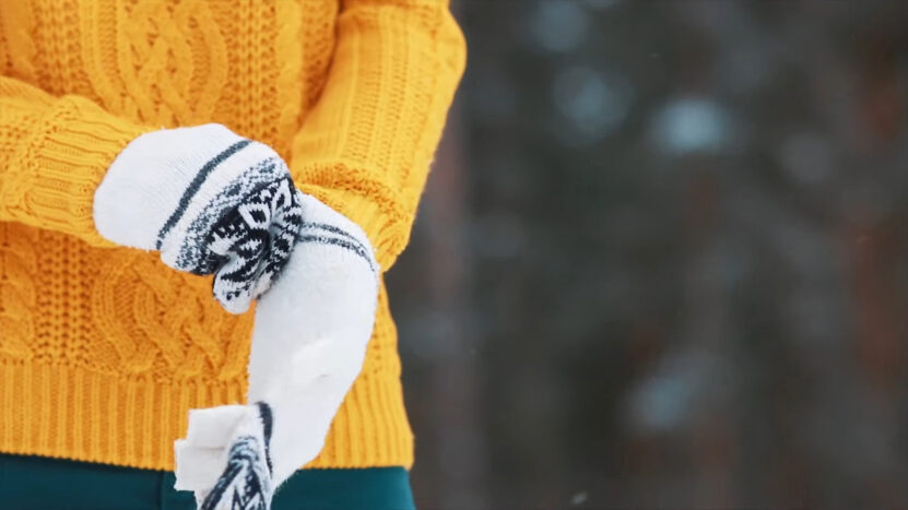 Man Puts Winter Gloves On